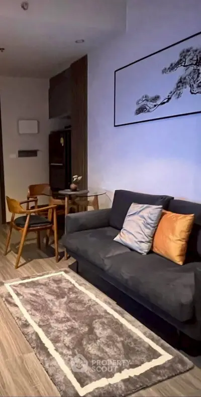 Modern living room with stylish decor and cozy seating area, perfect for relaxation and entertaining.