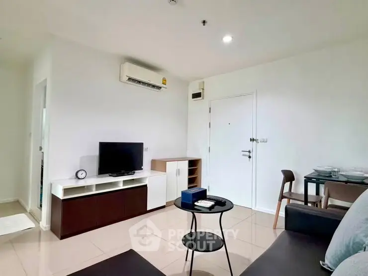 Modern living room with sleek furniture and air conditioning in a stylish apartment.