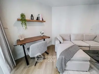 Modern living room with cozy sectional sofa and stylish workspace
