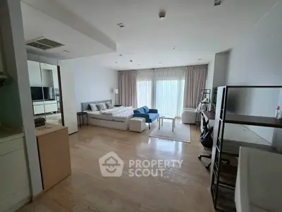 Spacious modern bedroom with elegant decor and natural light