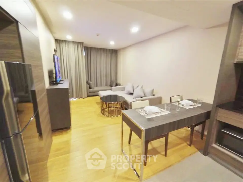 Modern living room with open layout and stylish furniture in a cozy apartment.