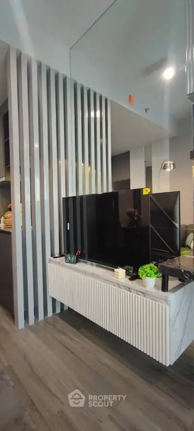 Modern living room with sleek TV setup and stylish decor
