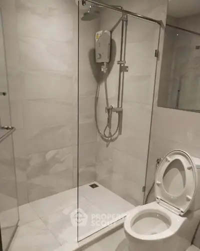 Modern bathroom with glass shower and sleek tile design