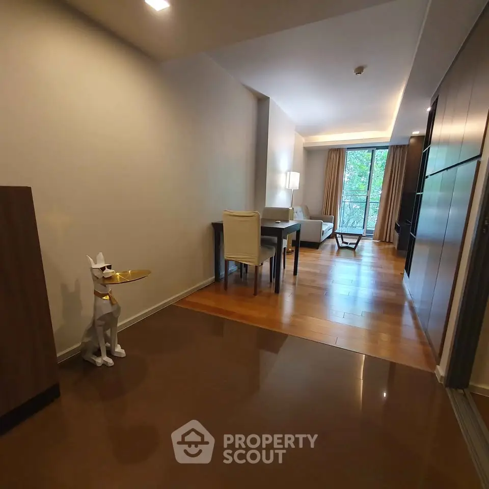 Modern living room with stylish decor and large windows for natural light.