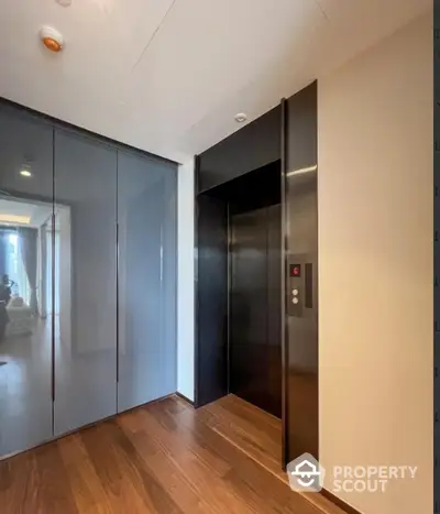 Modern apartment elevator with sleek design and wooden flooring