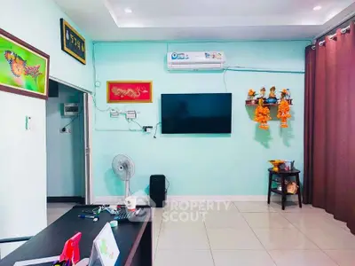 Modern living room with wall-mounted TV and air conditioning