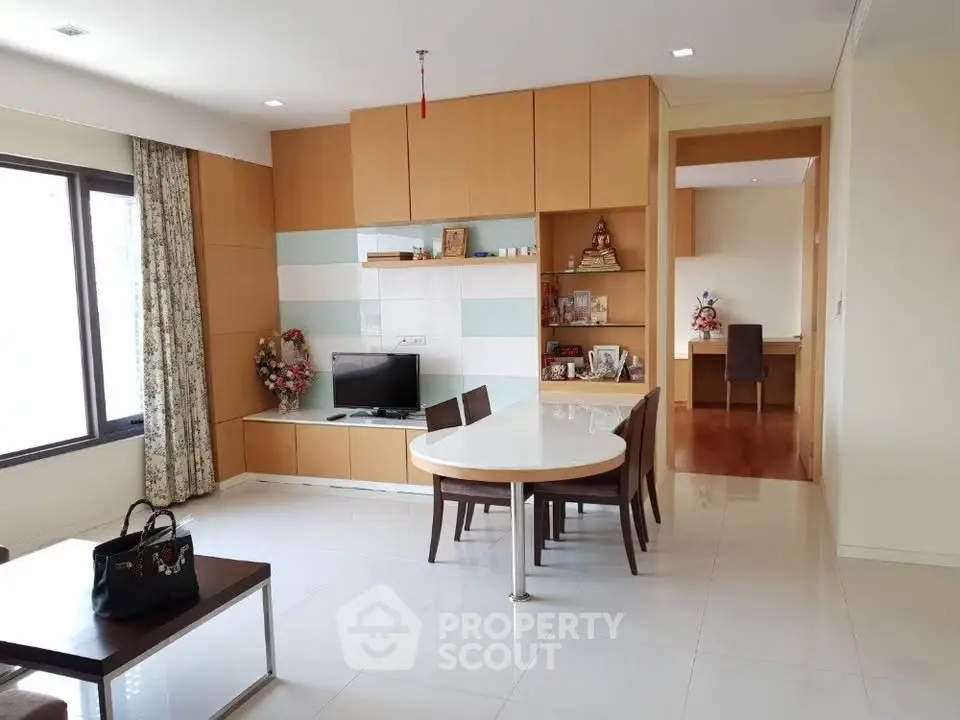 Spacious modern living room with dining area and built-in storage