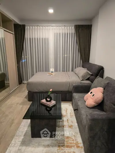 Modern bedroom with cozy sofa and stylish decor in a chic apartment