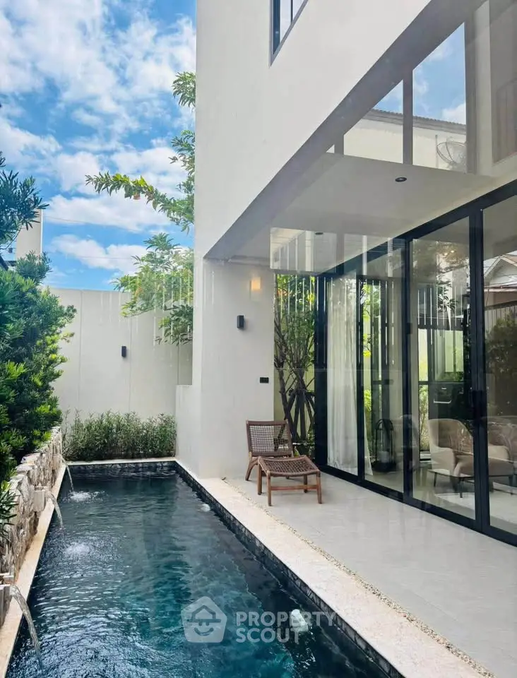 Luxurious modern villa with private pool and lush garden, perfect for relaxation and entertainment.
