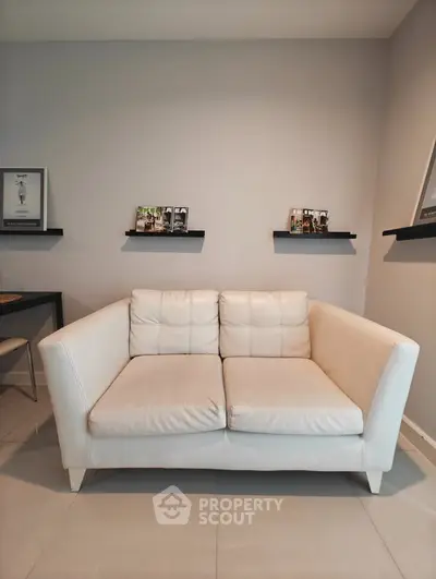 Modern living room with stylish white sofa and minimalist decor