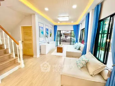 Bright and airy living room with modern decor and large windows