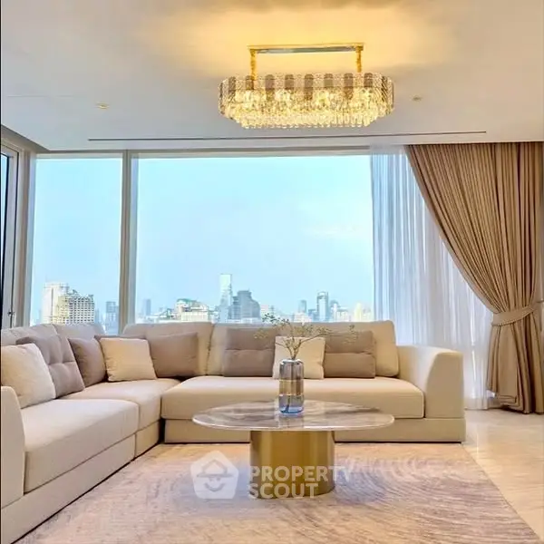 Luxurious living room with panoramic city view and elegant chandelier