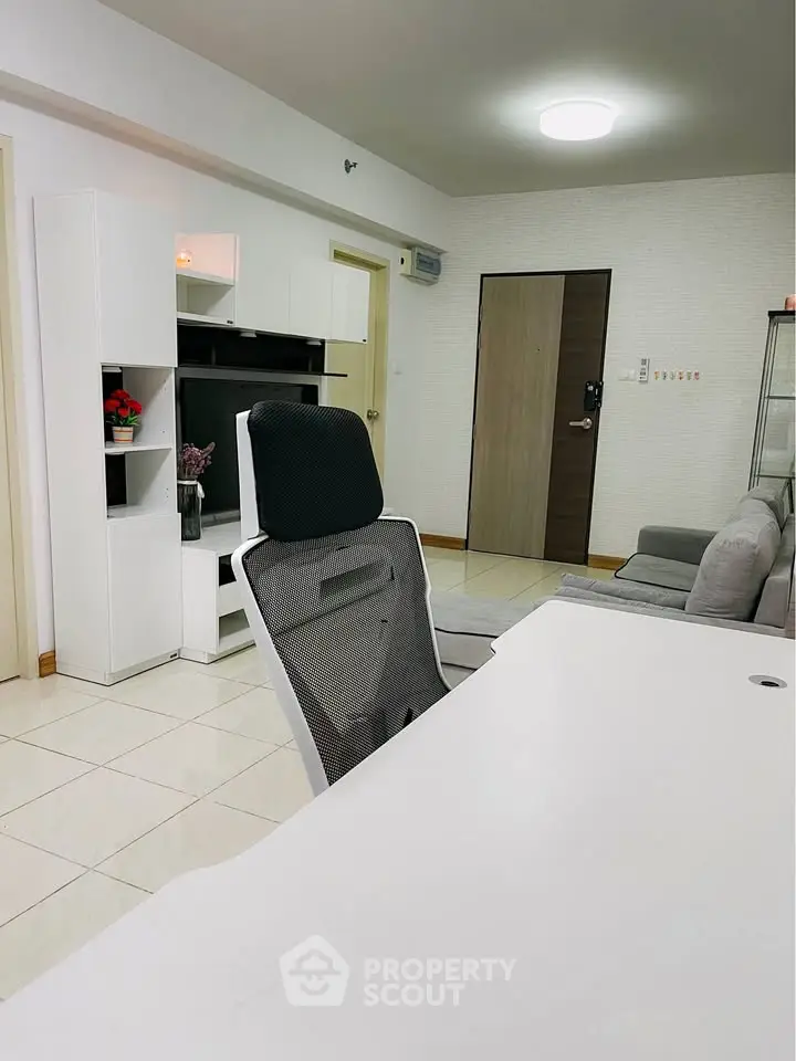 Modern living room with sleek furniture and bright lighting, perfect for comfortable living.