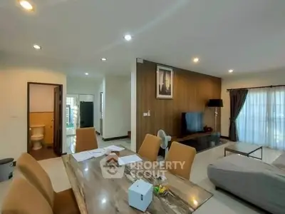 Spacious modern living room with elegant dining area and stylish decor