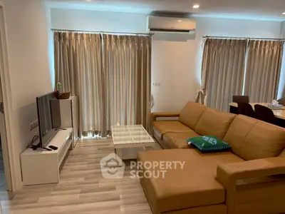 Spacious living room with modern furniture and natural light