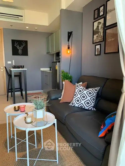 Modern living room with stylish decor, cozy seating, and contemporary lighting in a chic apartment.