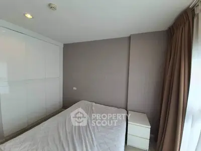 Spacious bedroom with modern design and ample natural light