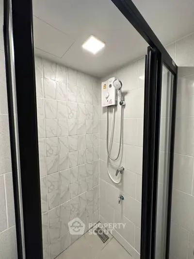 Modern bathroom with sleek shower enclosure and contemporary fixtures
