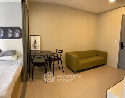 Modern studio apartment with cozy living area and stylish decor