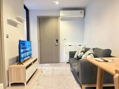 Modern living room with sleek furniture and wall-mounted TV, perfect for cozy relaxation.