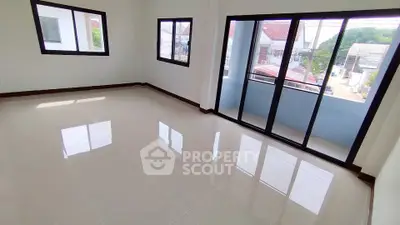 Spacious corner unit with large windows and balcony, offering abundant natural light and a serene view.