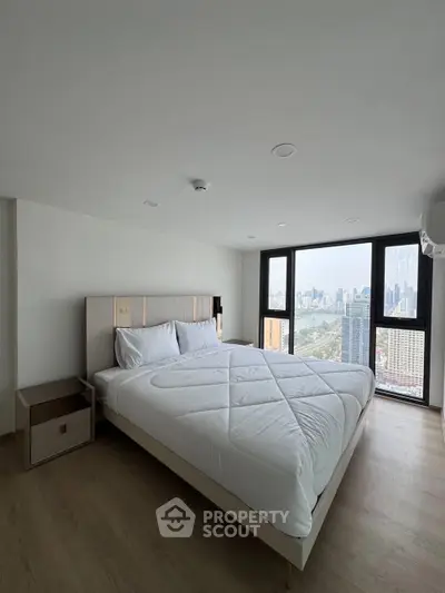 Modern bedroom with panoramic city view and stylish decor
