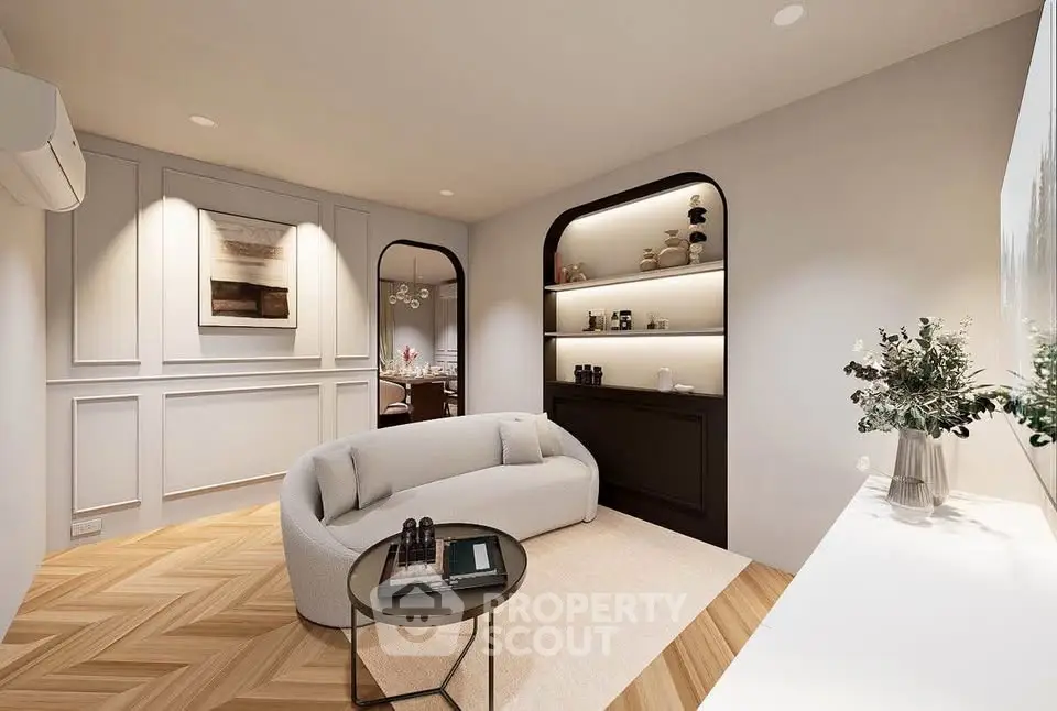 Elegant living room with modern decor and cozy seating area, perfect for relaxation and entertaining.