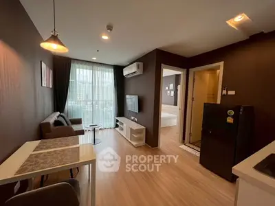 Modern living room with open layout and stylish decor in a cozy apartment.