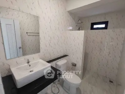 Modern bathroom with sleek fixtures and stylish tile design