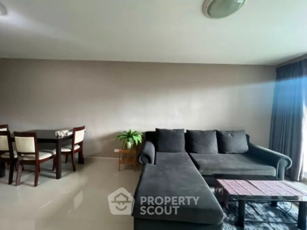 Modern living room with cozy seating and dining area