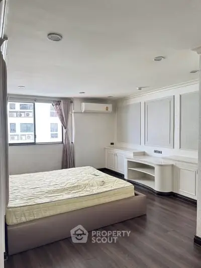 Spacious bedroom with elegant design and natural light