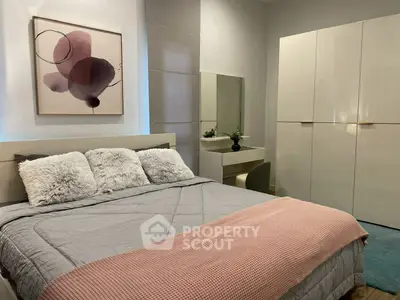 Modern bedroom with stylish decor and cozy bedding