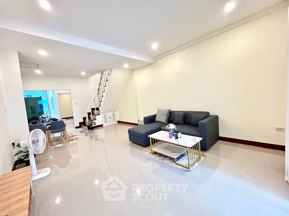 Spacious modern living room with sleek design and elegant furniture