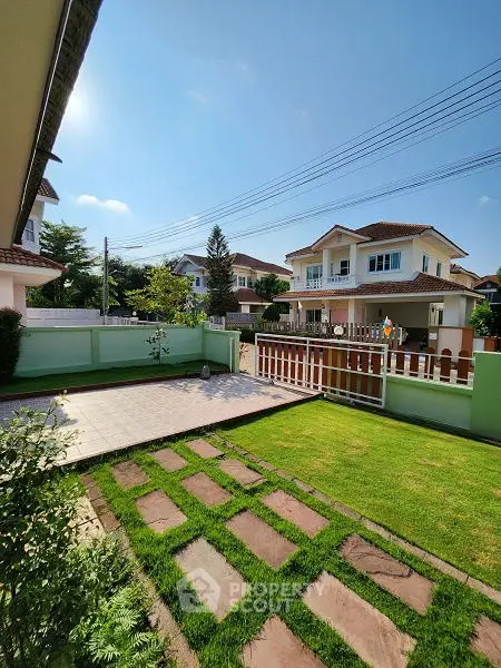 Charming suburban home with lush garden and spacious patio, perfect for family living.