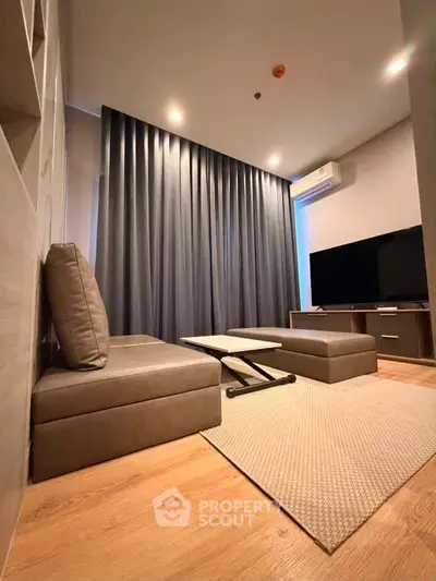 Modern living room with sleek furniture and ambient lighting, perfect for relaxation and entertainment.