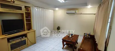 Spacious living room with air conditioning and elegant wooden furniture