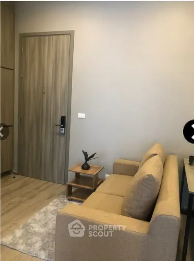 Cozy living room with modern beige sofa and wooden accents