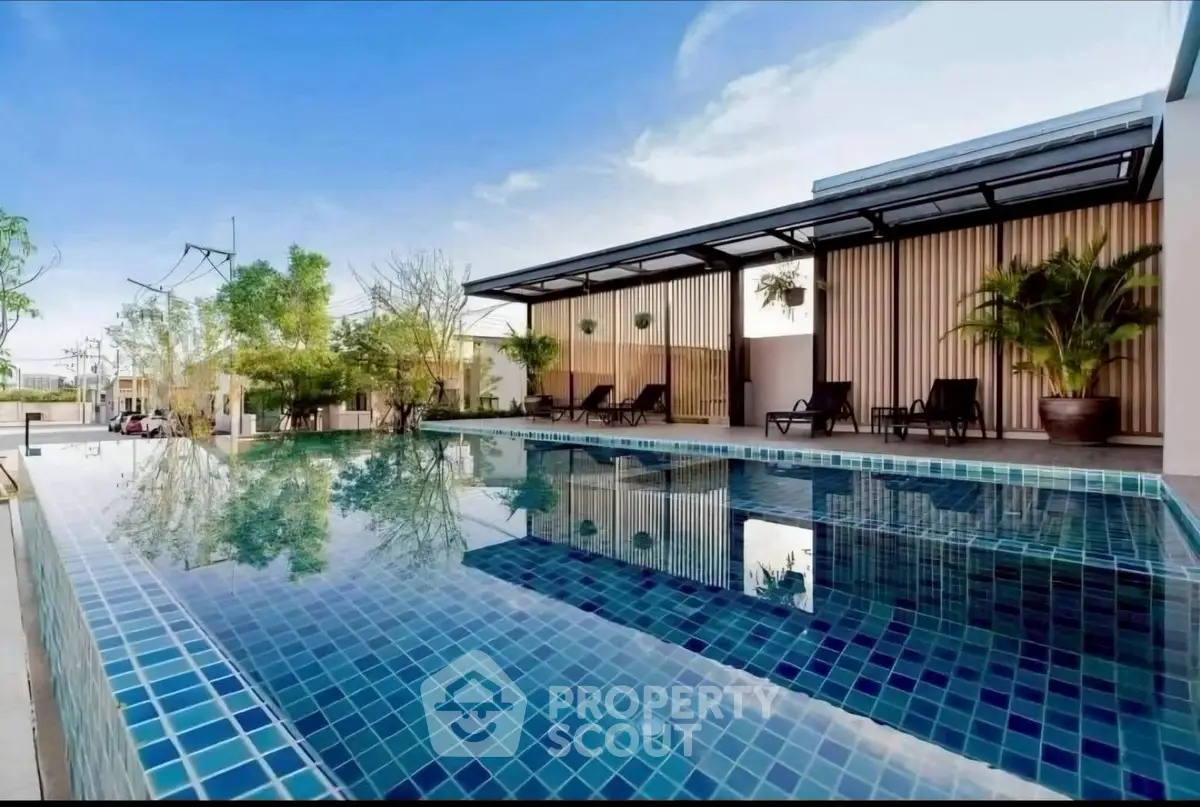 Luxurious outdoor pool area with modern design and serene ambiance, perfect for relaxation and leisure.