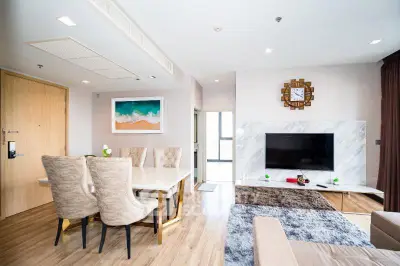 Modern living room with elegant dining area and large TV
