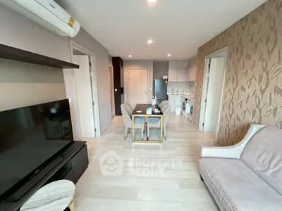 Modern living room with open kitchen and stylish decor