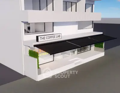 Modern coffee shop exterior with sleek design and large awning, perfect for urban settings.