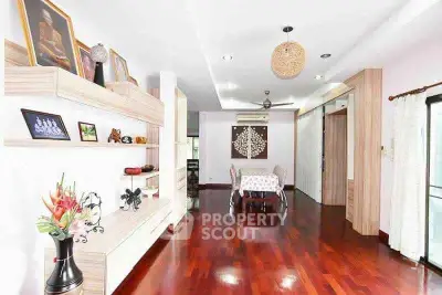 Spacious living room with wooden flooring and elegant decor