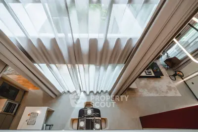 Luxurious modern living room with high ceilings and elegant decor