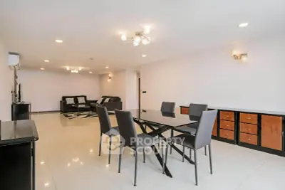 Spacious modern living room with elegant dining area and stylish lighting