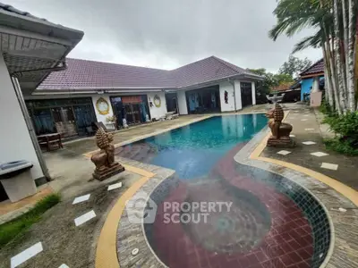 Luxurious villa with stunning pool and elegant exterior design, perfect for tropical living.
