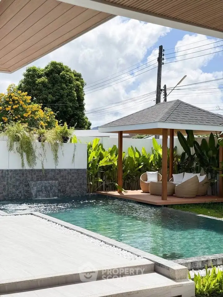 Luxurious outdoor pool area with modern gazebo and lush greenery, perfect for relaxation and entertainment.