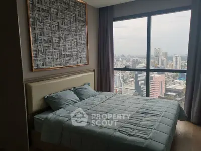 Luxurious bedroom with stunning city view from high-rise apartment window