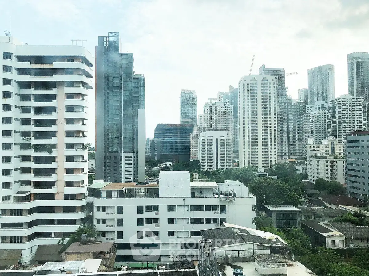 Stunning cityscape view showcasing modern high-rise buildings and lush greenery, perfect for urban living.