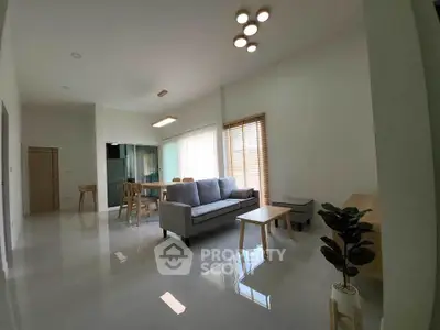 Spacious modern living room with sleek furniture and natural light