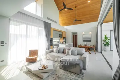 Luxurious open-plan living room with high ceilings and modern decor